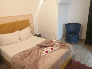 Postel nebo postele na pokoji v ubytování Hôtel Agnaou