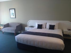 Postel nebo postele na pokoji v ubytování Cornwall Motor Lodge