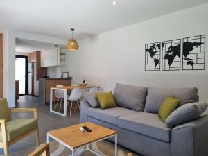 a living room with a couch and a table at Villa Las Moras in Ciudad Lujan de Cuyo