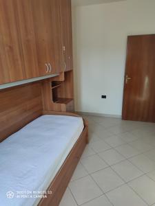 Łóżko lub łóżka w pokoju w obiekcie Appartamento Con terrazza