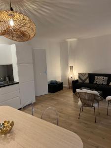 a living room with a couch and a table at NOTRE DAME - STYLISH APARTMENT in Paris +31 photos