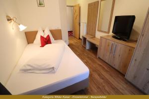 TV o dispositivi per l'intrattenimento presso Ferienhotel Fuchs