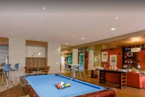 a living room with a pool table in it at Home felt apartment- Med Center/NRG in Houston