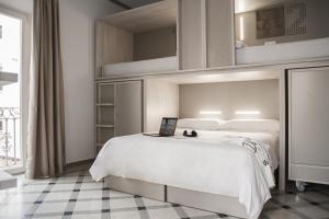 Łóżko lub łóżka w pokoju w obiekcie room00 Salvador Hostel