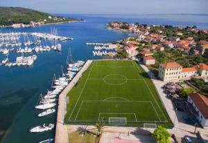 an aerial view of a soccer field in a marina at Apartman Carpe Diem in Sutomišćica