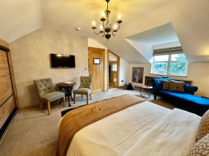 a bedroom with a large bed and a living room at Rose Cottage B&B in Swords