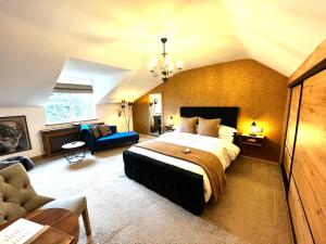 a bedroom with a large bed and a living room at Rose Cottage B&B in Swords