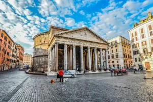 a group of people standing in front of a building at Mia House Roma in Rome