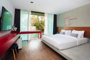 En eller flere senger på et rom på Stellars Samed Resort