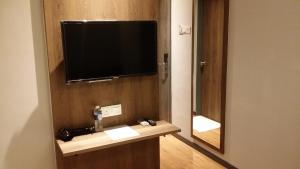 TV a/nebo společenská místnost v ubytování Go Hotel