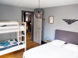 a bedroom with two bunk beds and a hallway at Appartement Maison Vosgienne La Bresse Centre in La Bresse
