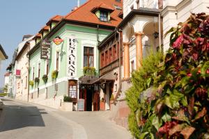 a building on the side of a street at Hotel Kuria in Banská Bystrica