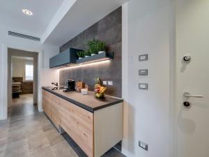 a kitchen with a island with a counter top at Venice Green Residence in Mestre