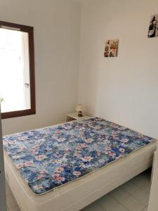 Posteľ alebo postele v izbe v ubytovaní AMOUREVA Joli T3 vue mer piscine Cap d Agde