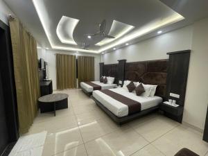 Hotel The Vaishvik客房内的一张或多张床位