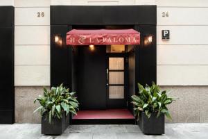 a entrance to a hotel with a red sign on it at H La Paloma Adults Only in Barcelona