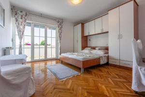 Postel nebo postele na pokoji v ubytování Apartments Vila Antula