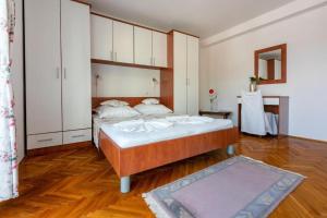 Postel nebo postele na pokoji v ubytování Apartments Vila Antula