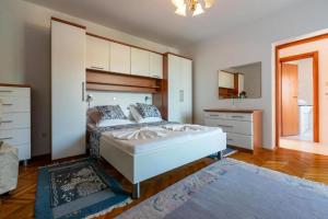 Postel nebo postele na pokoji v ubytování Apartments Vila Antula