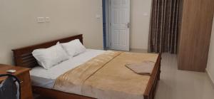 Кровать или кровати в номере The Nutmeg River House