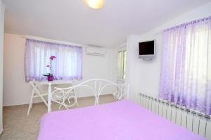 Postel nebo postele na pokoji v ubytování Apartments Ivan Marina
