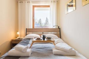 Posteľ alebo postele v izbe v ubytovaní Apartament Cztery Tulipany Zakopane