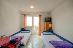 Posteľ alebo postele v izbe v ubytovaní Apartments Lucia
