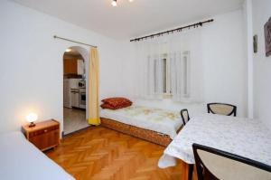 Posteľ alebo postele v izbe v ubytovaní Apartments Lucia