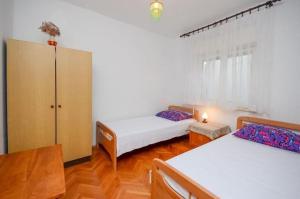 Posteľ alebo postele v izbe v ubytovaní Apartments Lucia