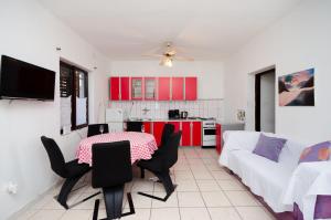 a kitchen and living room with a table and chairs at Apartments Petra in Crikvenica