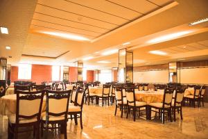 a banquet hall with tables and chairs in it at Linh Phuong 8 Hotel in Can Tho