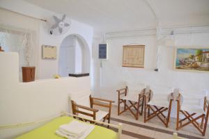 a dining room with a table and chairs at Milos Apartments Kardapis Ground Floor in Klima