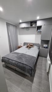 Postel nebo postele na pokoji v ubytování HT Apartman