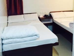 Un pat sau paturi într-o cameră la Om Guest House