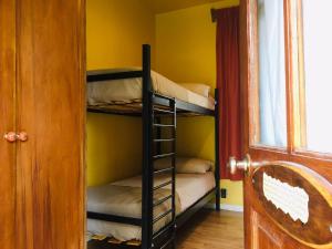 a room with two bunk beds in a room at House 1903 in Ushuaia