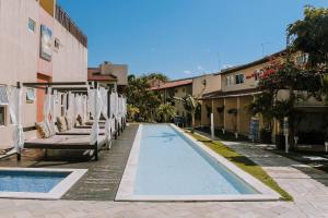 Bazén v ubytovaní Qavi - Apartamento no Centro de Pipa #Solar216 alebo v jeho blízkosti