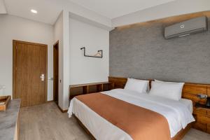 Katil atau katil-katil dalam bilik di Ivy Hotel