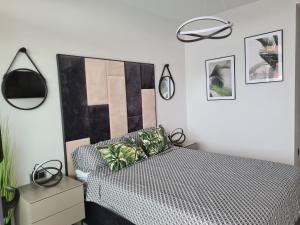 Posteľ alebo postele v izbe v ubytovaní Apartament Sunset Waves 67