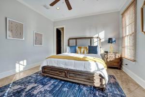 a bedroom with a large bed and a blue rug at Luxury home with outdoor patio and game room in Memphis