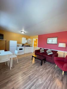 a living room with a couch and a table at Fair Isle Motel in Charlottetown