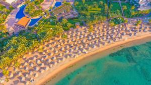 an aerial view of a beach with umbrellas at Fort Arabesque Resort, Spa & Villas in Hurghada