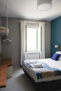 a bedroom with a large bed and a window at Il Bordone - appartamento con vista mare in Manarola