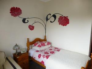 a bedroom with a bed and a lamp at Woodlands Hotel in Birmingham