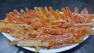 a plate of french fries with powdered sugar on it at Agriturismo SoleMare in Stromboli