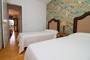 Posteľ alebo postele v izbe v ubytovaní Sea View Meloneras Terrace Duplex +Wifi +Barbecue
