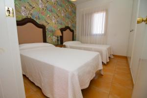 Posteľ alebo postele v izbe v ubytovaní Sea View Meloneras Terrace Duplex +Wifi +Barbecue