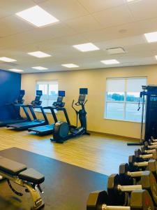 a gym with rows of treadmills and exercise bikes at Hampton Inn by Hilton Port Hope Cobourg in Port Hope