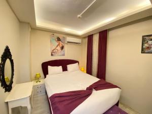 Postel nebo postele na pokoji v ubytování Şirinyer Elit Residance Apart Hotel + 37 fotografií