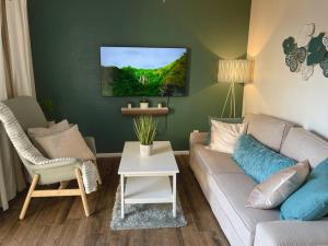 a living room with a couch and a table at Contemporary 2-Bedroom Rental Unit in Eagle Pass