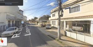 a street with cars parked on the side of the road at Entire apartment (1) with reversible living room in Volta Redonda